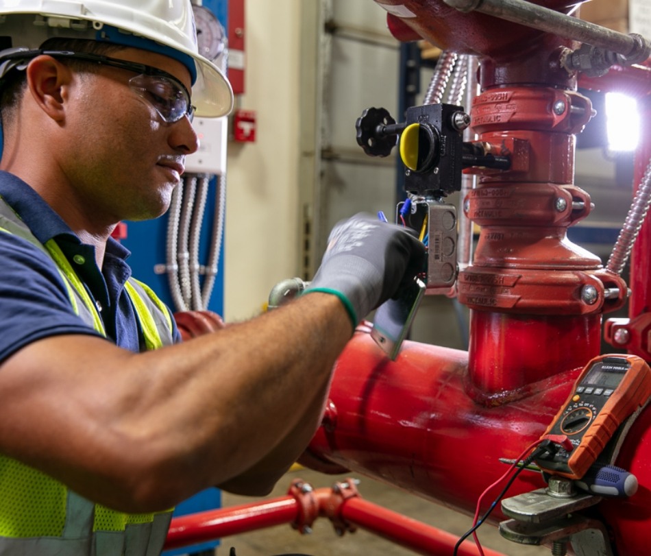 Wiginton worker testing pipes