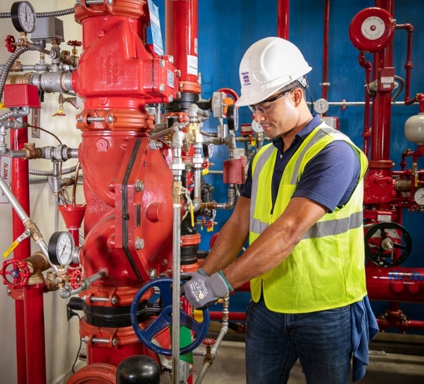 Wiginton worker testing pipes